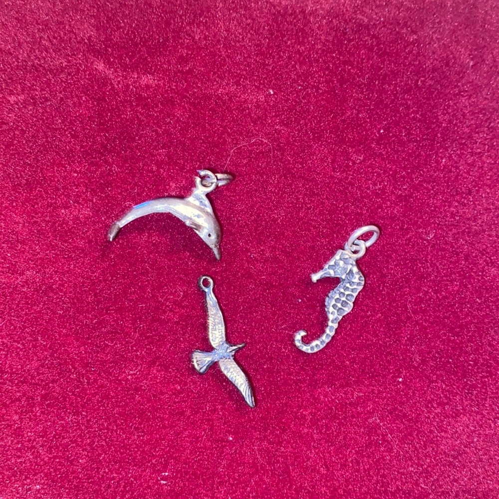 Ocean charms dolphin, seahorse and gull